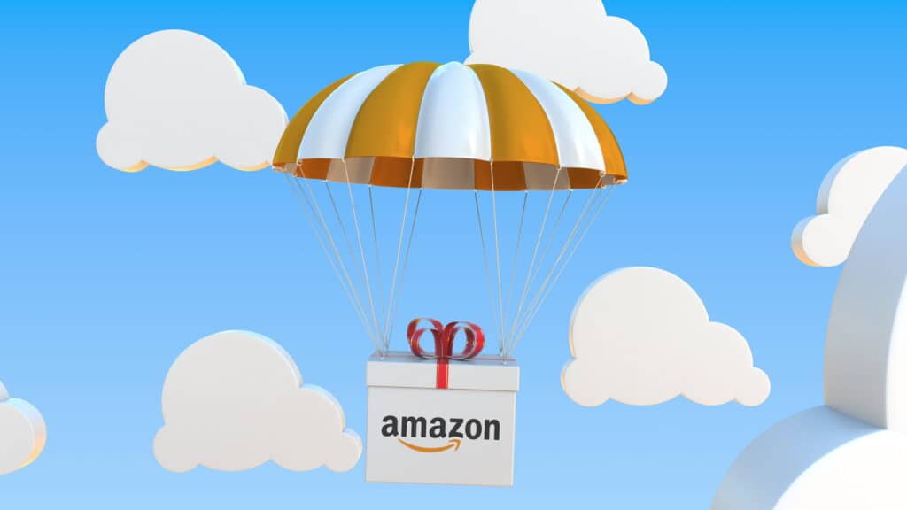A gift box with the amazon logo on it is flying in the sky, representing the endless possibilities of dropshipping on Amazon without money.