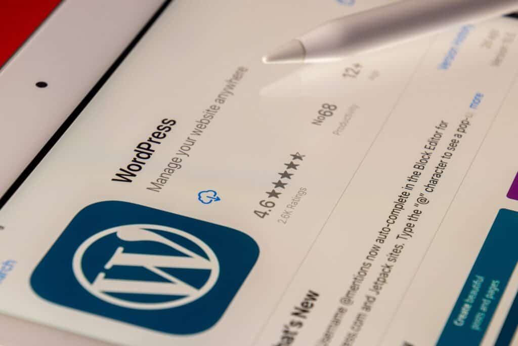 A WordPress app is displayed on an iPad, showcasing its suitability for ecommerce.