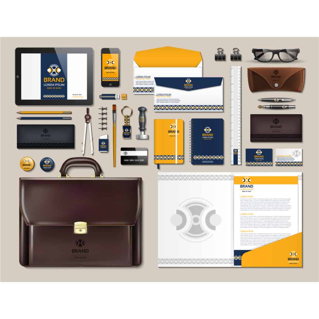 Business stationery set with a briefcase, phone and tablet featuring print on demand journals.