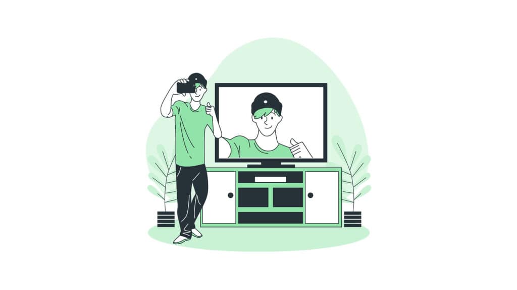 A man is watching a green screen.