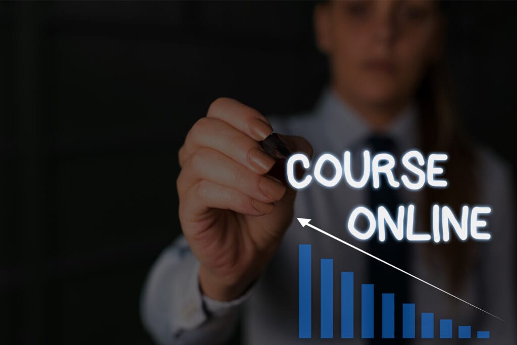 A woman is writing the word "course" online with a marker for a website that sells courses.